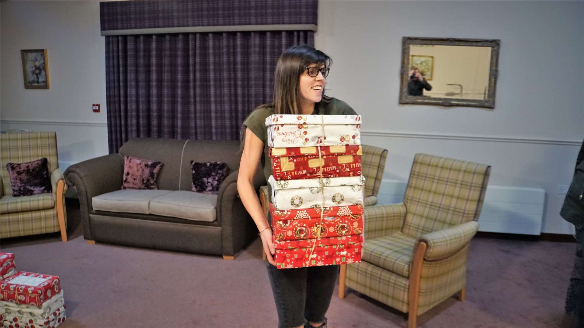 Tanya Sutherland, activities organiser at Pentland View, helps take the boxes out of the home to start their journey to poverty-stricken countries for Christmas.