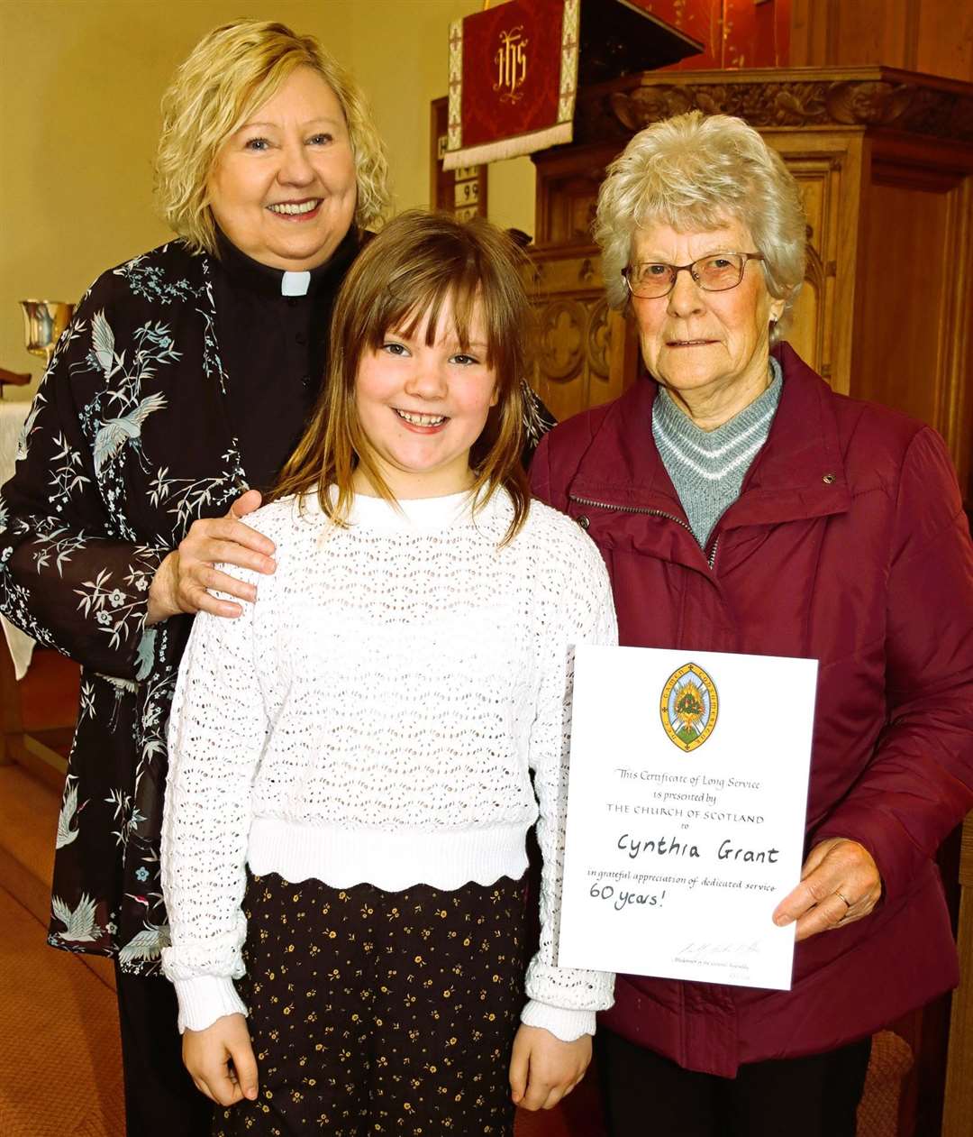 From left, Rev Janet Easton-Berry, Susanna Mackay, and Cynthia Grant with her certificate celebrating 60 years of service playing the church organ at Keiss. Picture: Neil Buchan