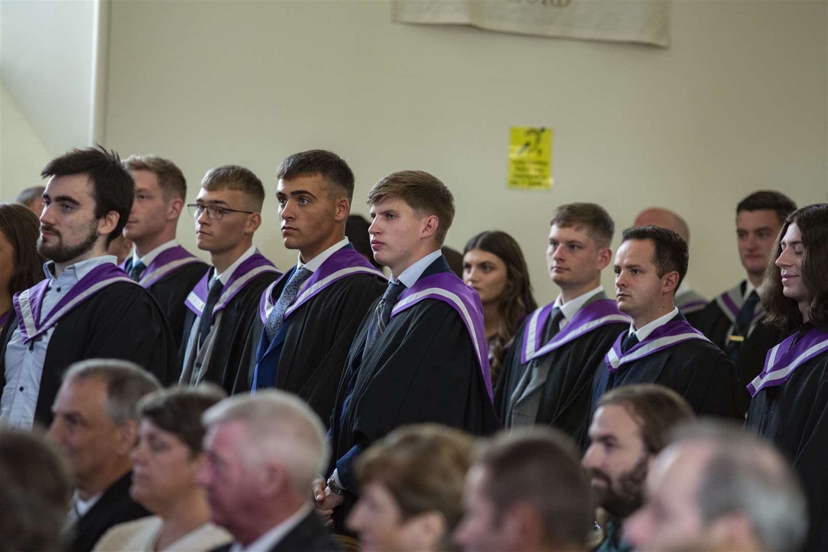 Students stand as they are congratulated by vice-principal Debbie Miller.