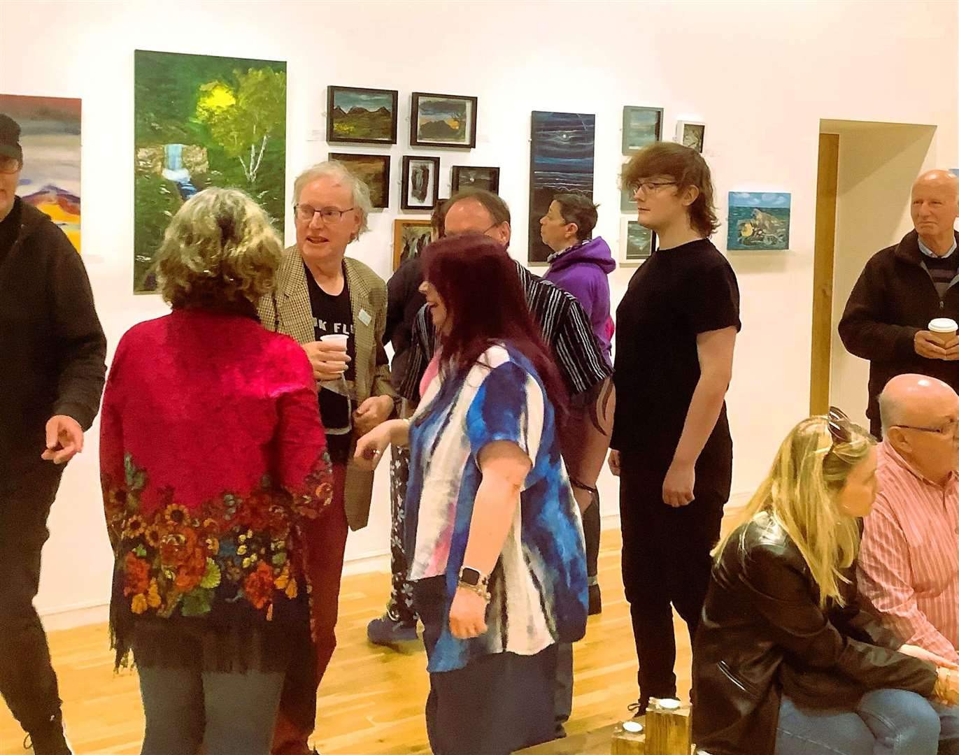 A mix of artists and visitors at the opening of the show on Friday.