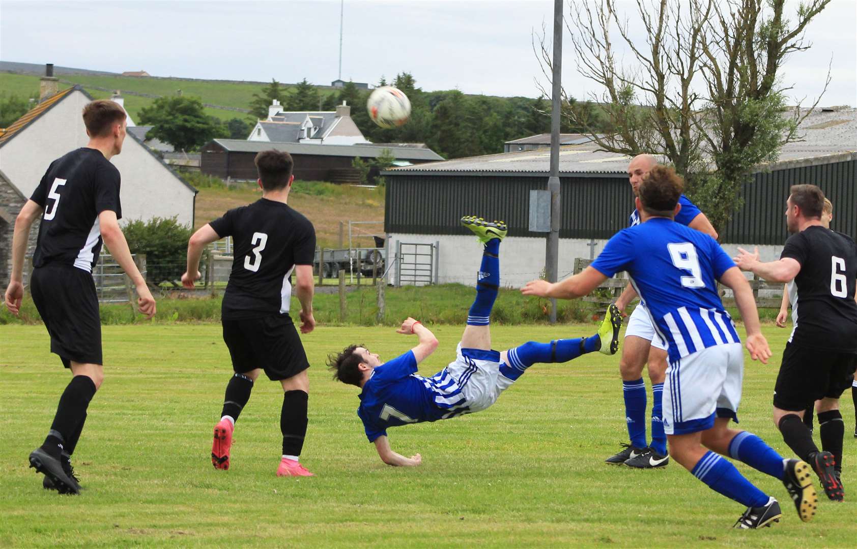 Lybster's Andrew Sutherland attempts an overhead kick during Tuesday's David Allan Shield tie against Swifts.