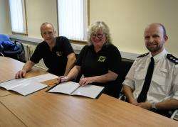 Sergeant Niall MacLean (left), of the Northern Constabulary’s dog section, CASST chairwoman Val Ashpool and Chief Inspector Matthew Reiss at the signing of the memorandum on Tuesday.