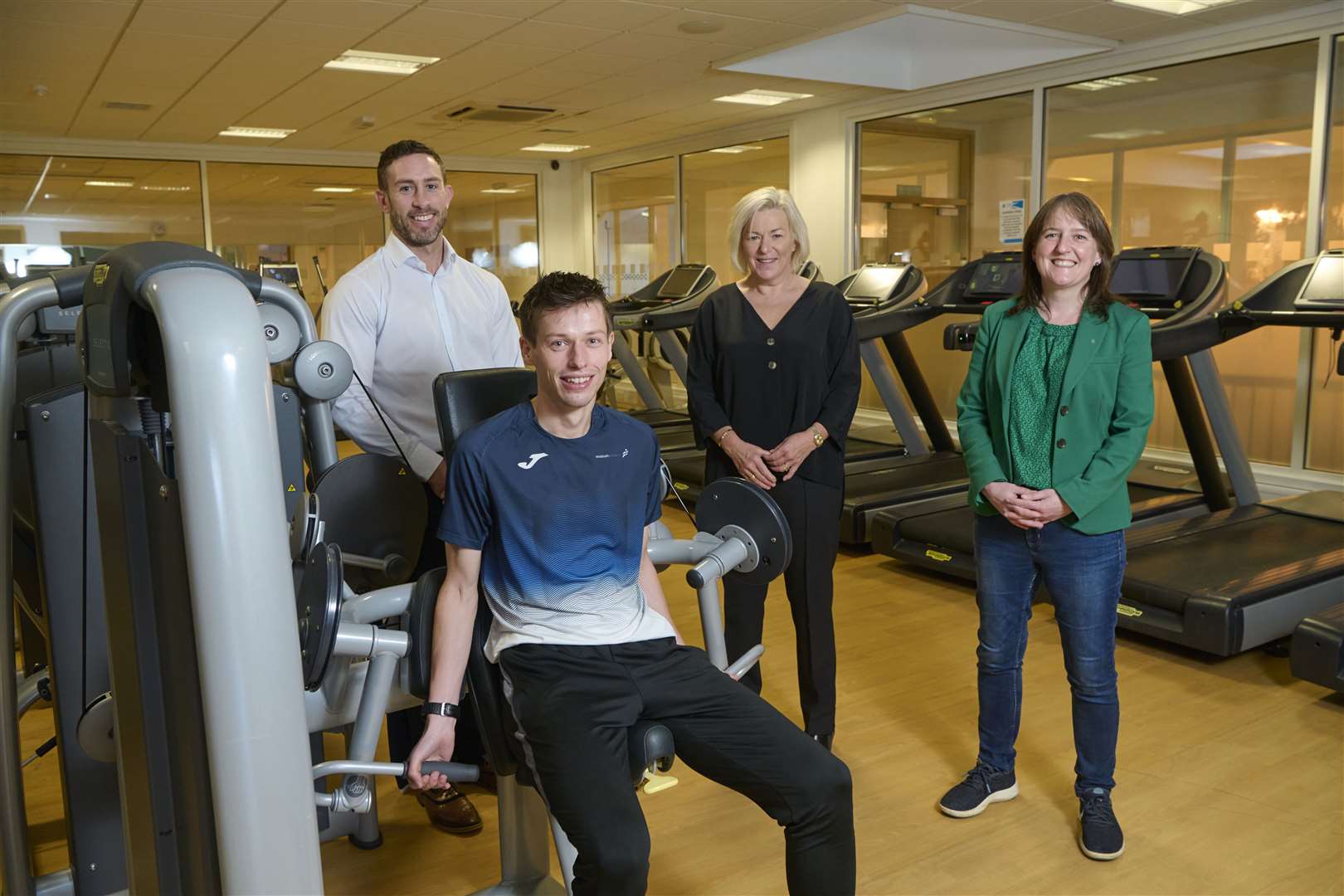 Graham Lindsay (SportScotland), Mags Duncan (High Life Highland) and Maree Todd (sports minister) with endurance runner Stephen Mackay.