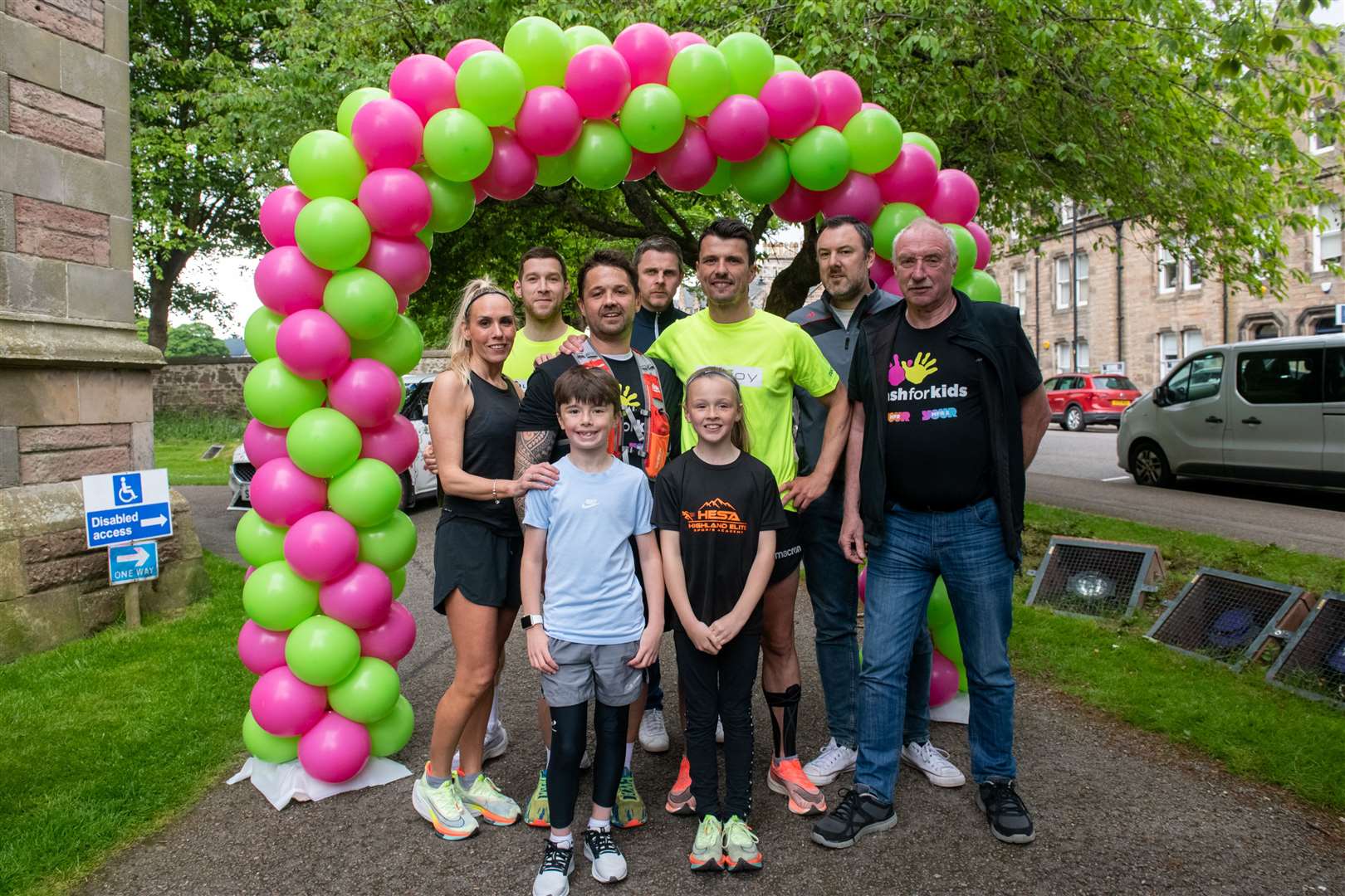 Steven Mackay at the finish line with some of his support runners and team. Picture: Callum Mackay