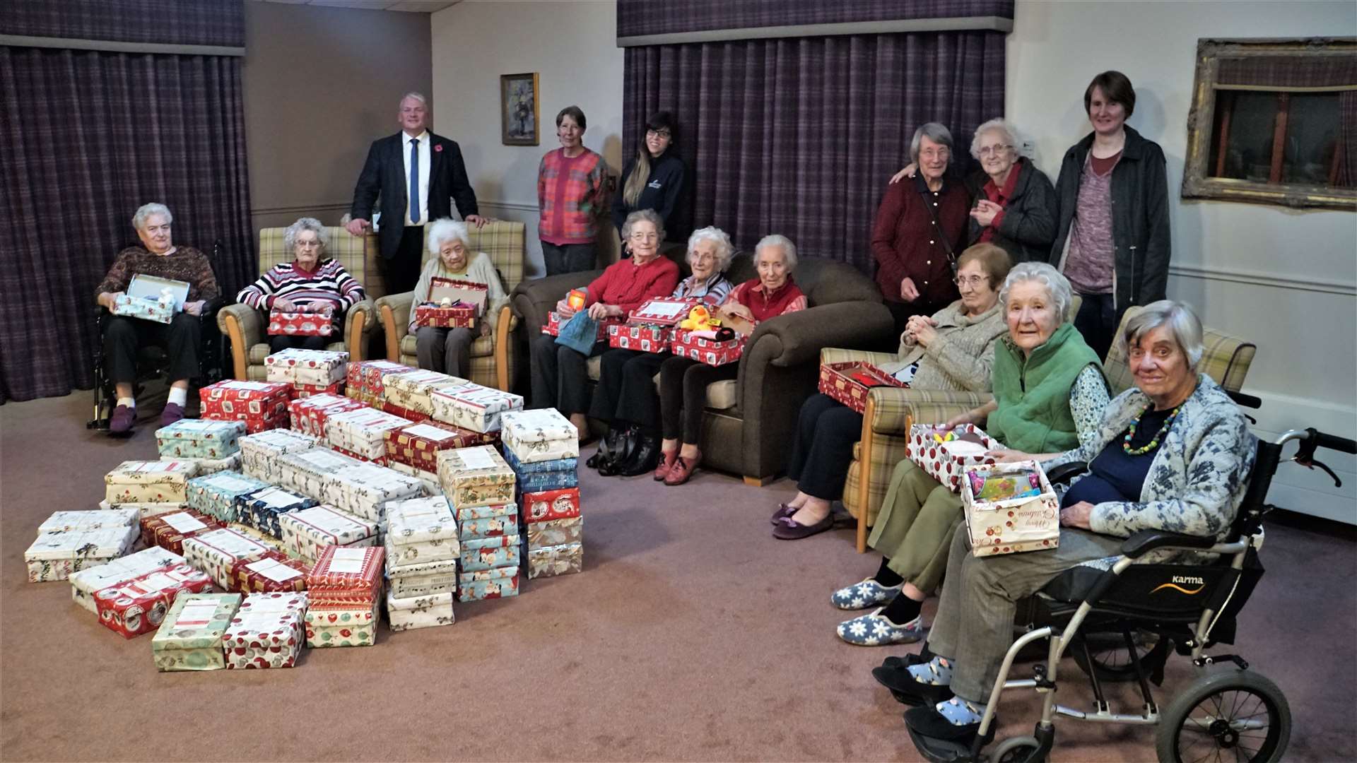 The Rev David Malcolm along with staff and residents from Pentland View and the 89 boxes they filled for the Blythswood Christmas Shoebox Appeal. Pictures: DGS