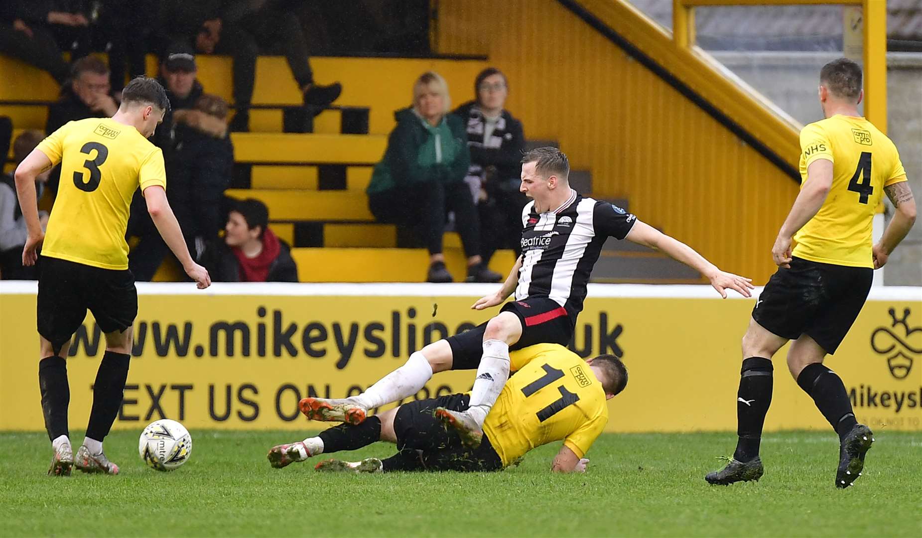 Nairn County's Ciaran Young clatters into Wick Academy's Steven Anderson during the 2-2 draw at Station Park last Saturday. Picture: Mel Roger