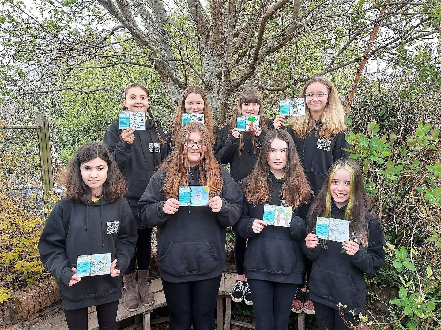 Pupils at Cradlehall Primary School show off their completed postcards.Back (l-r): Susanna, Alicia, Kasey, Amelia. Front (l-r): Katie, Abbey, Naimh, Alexia.