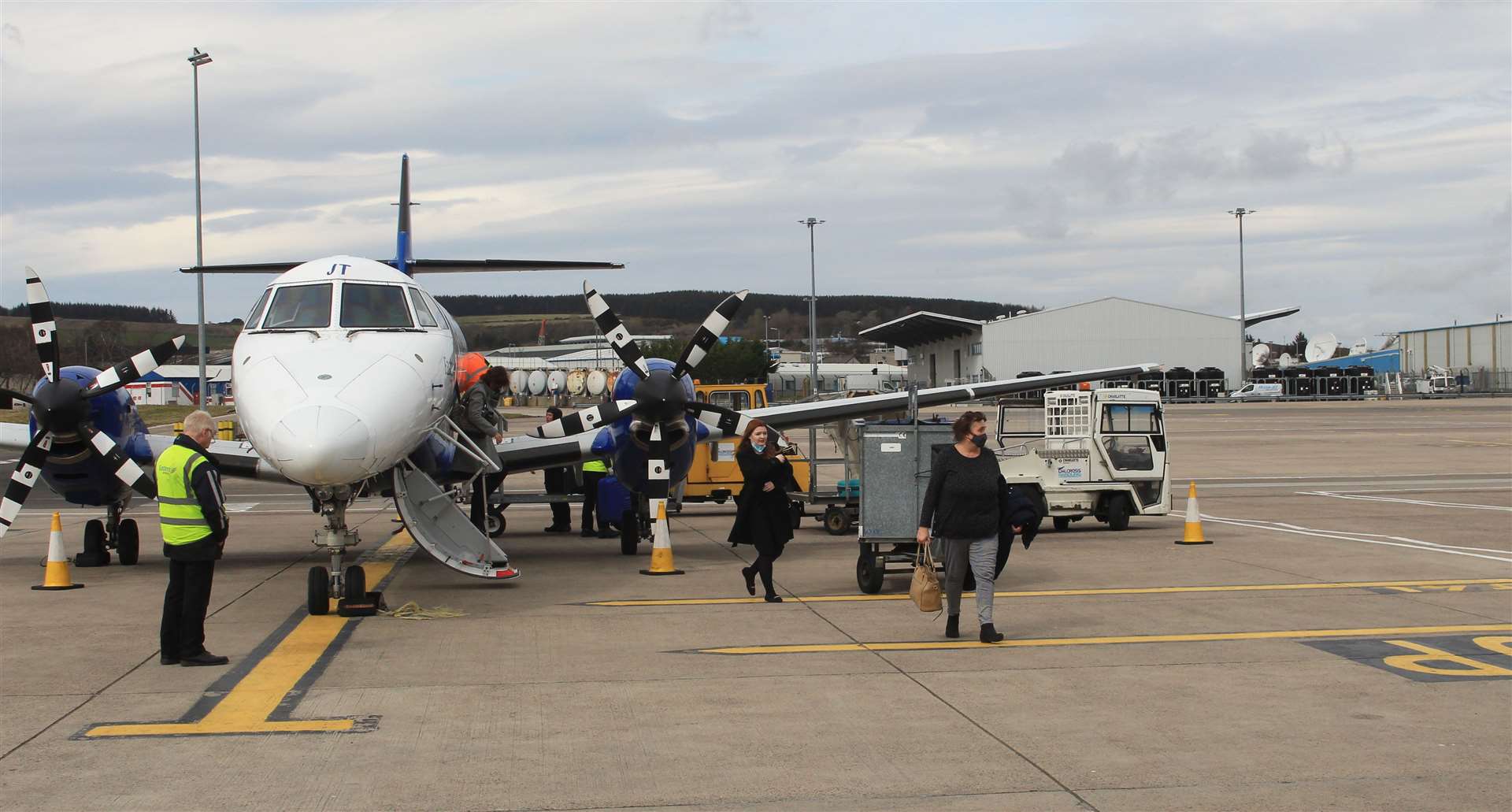 Passengers disembark after arriving at Aberdeen Airport on the first of the reinstated flights from Wick in April 2022. Picture: Alan Hendry