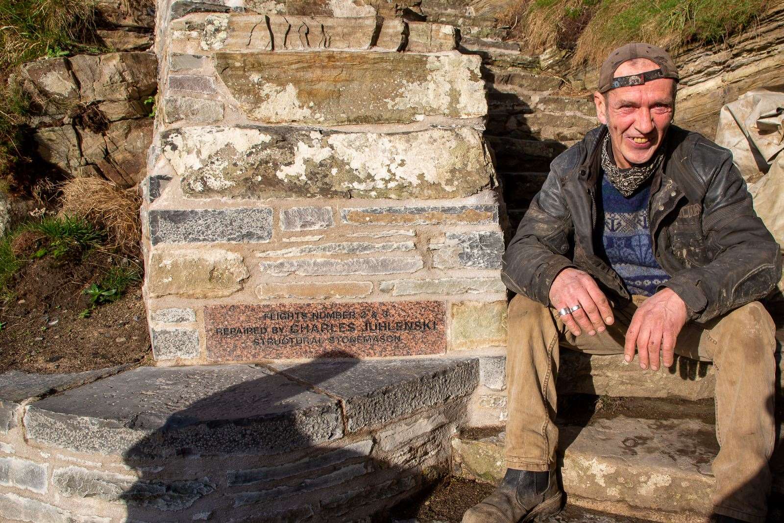 Grant Coghill took this photo of Charles Juhlenski, a stonemason who worked on the final repairs.