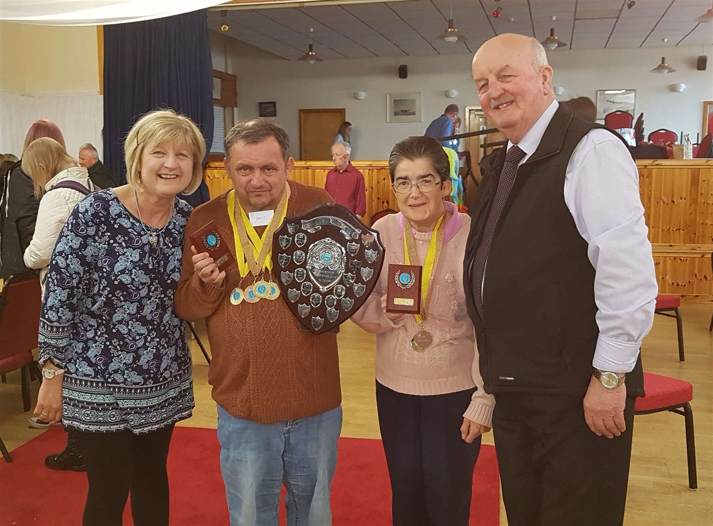 Overall champion at Thurso Rotary Club's Fun Day was David Gunn, with Susan Cowie the ladies' winner. Presenting all the individual medals were Enable Caithness chairman Willie Mackay (right) and his wife Glynis.