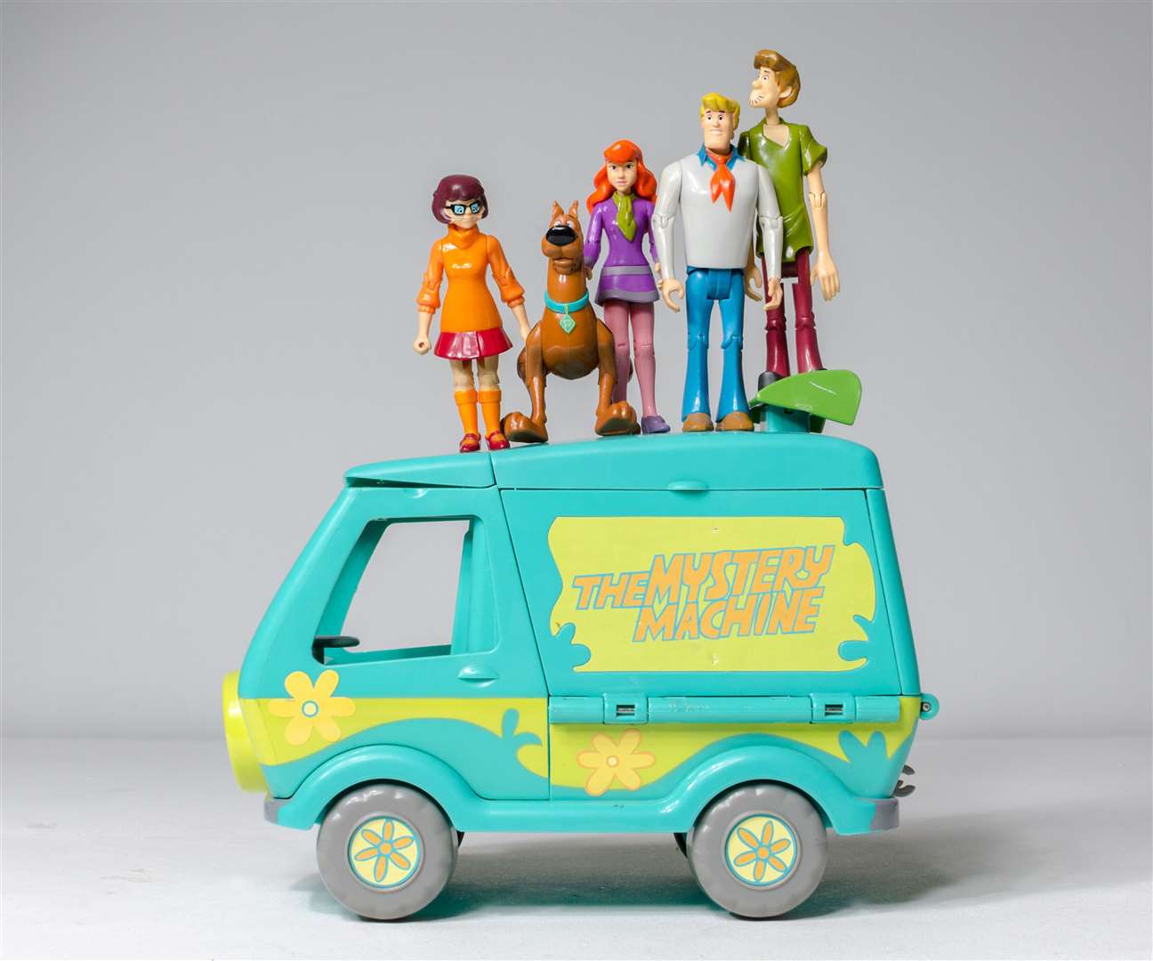 The Scooby Doo Mystery Machine from Hanna Barbera toys with regular series characters, from left, Velma Dinkley, Scooby Doo, Daphne Blake, Fred Jones and Shaggy Rogers. Picture: Adobe Stock