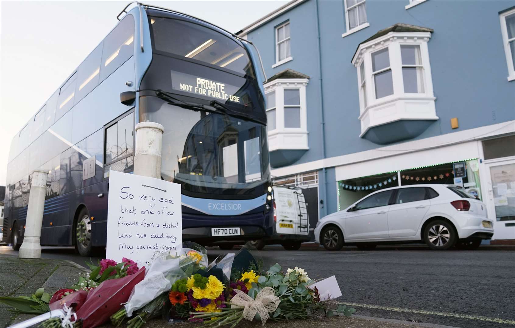 Flowers were left at the entrance to the port following Mr Farruku’s death (Andrew Matthews/PA)