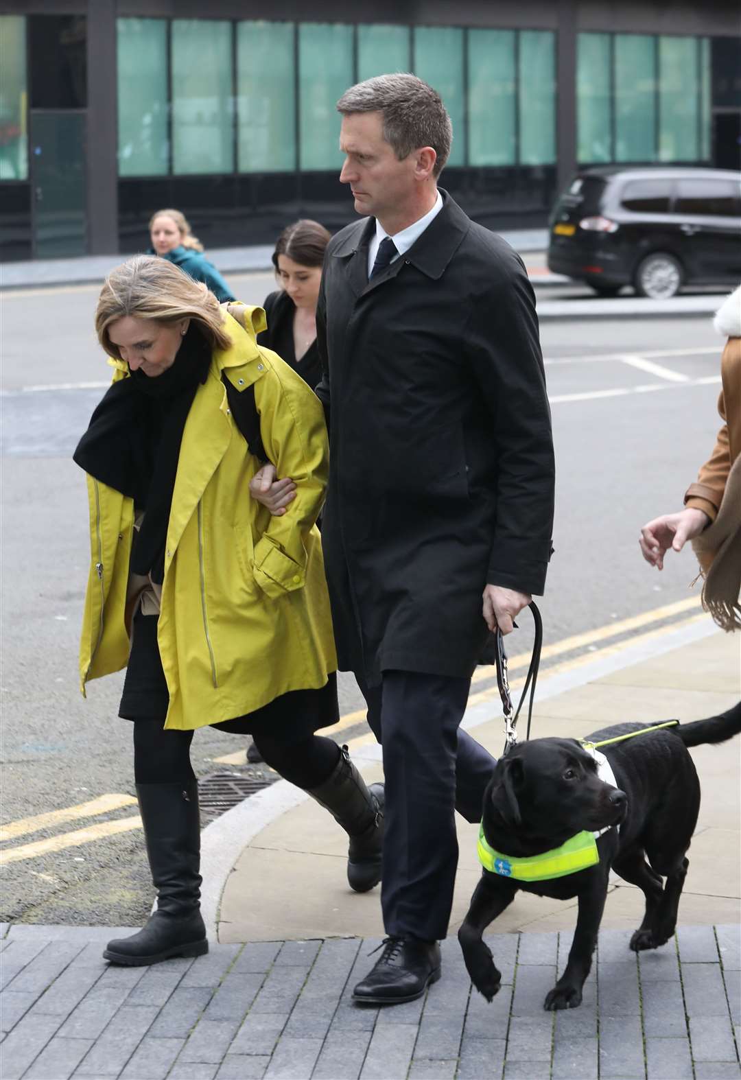 Lord Holmes of Richmond was helped from the dog by his wife and alongside his guide dog (Philip Toscano/PA)