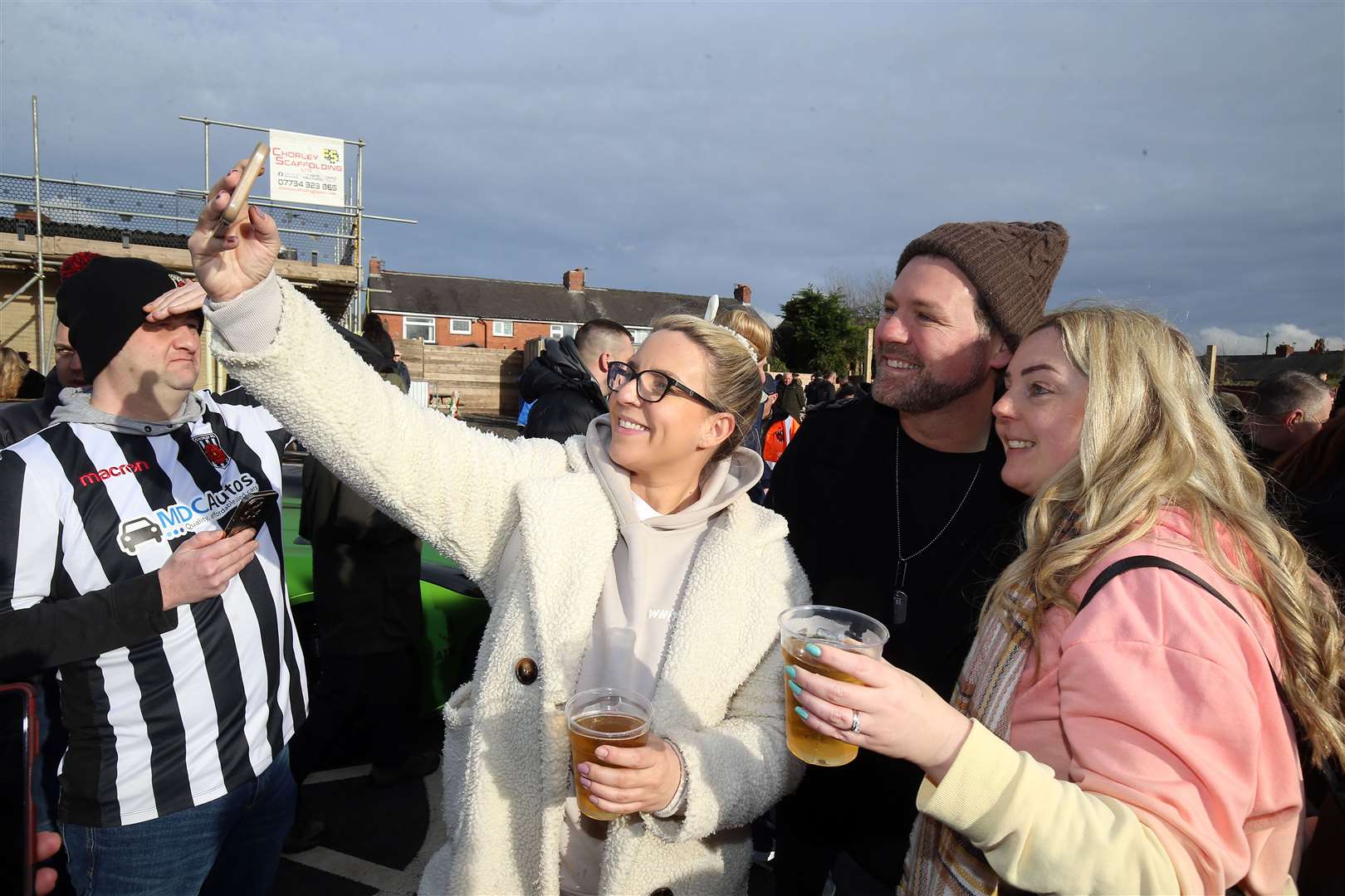 Brian McFadden joins a picture with Chorley fans (Nigel French/PA)