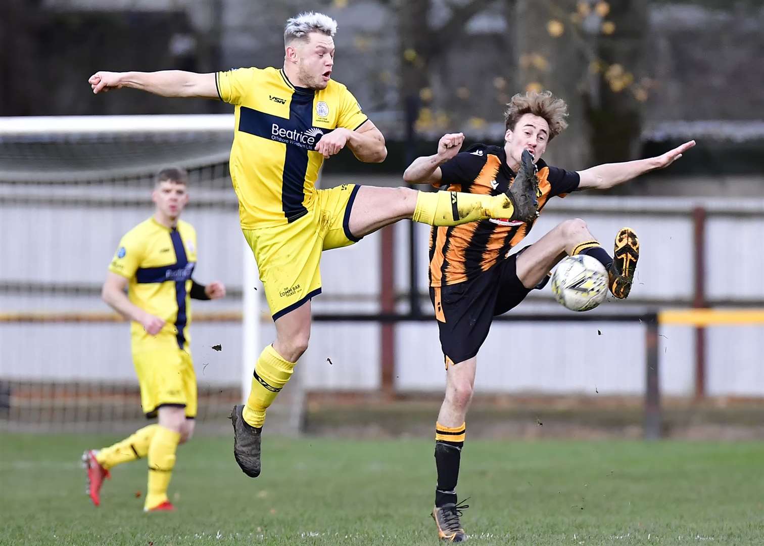Wick Academy's Jack Halliday and Huntly's Gavin Elphinstone. Picture: Mel Roger