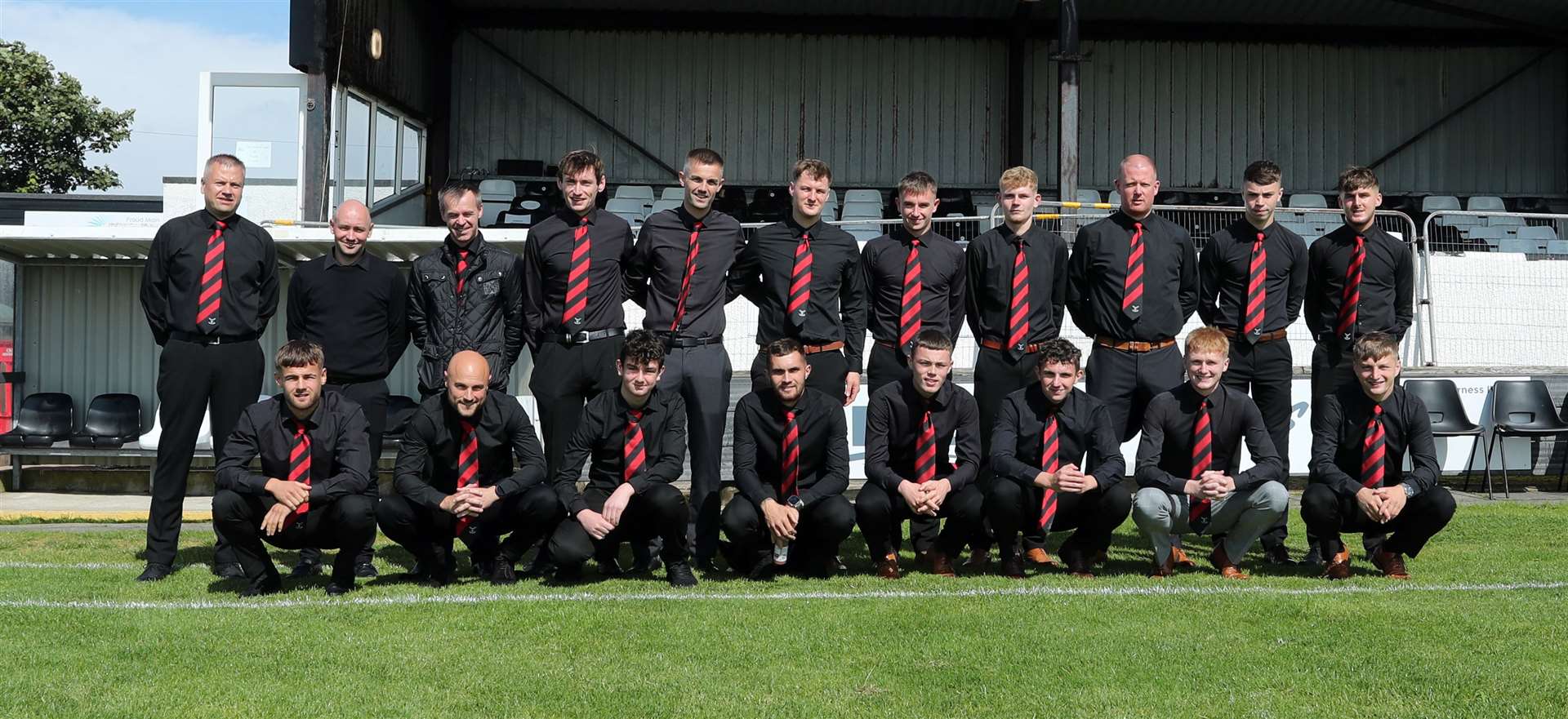 The Wick Groats players and management in their suits before the Highland Amateur Cup final. Picture: James Gunn