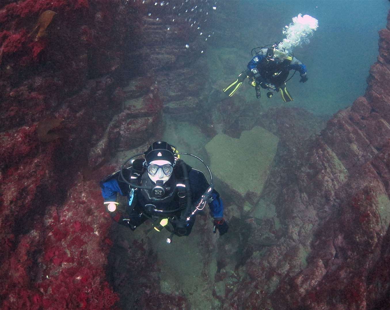 Divers in Geo of Sclaites, Duncansby Head.