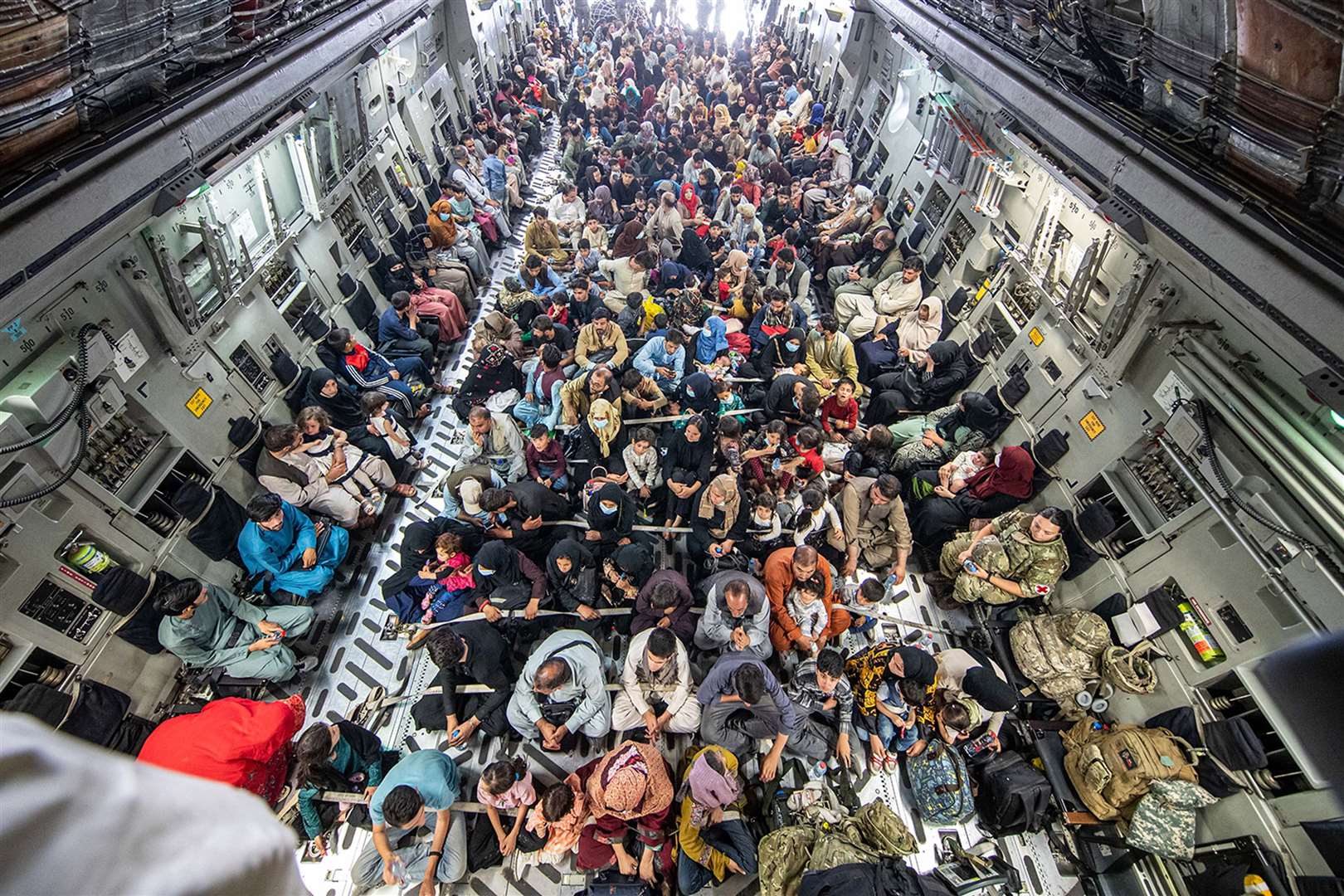 A full flight of 265 people supported by members of the UK Armed Forces on board an evacuation flight (Ministry of Defence/PA)