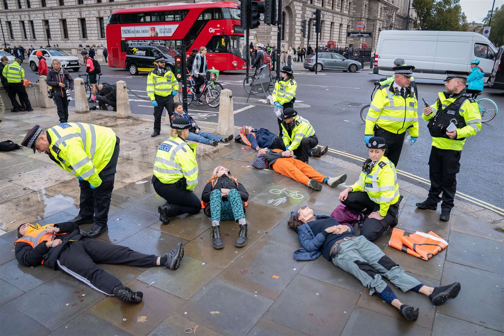 Just Stop Oil activists are detained by police officers during a demonstration in Parliament Square, Westminster (Stefan Rousseau/PA)