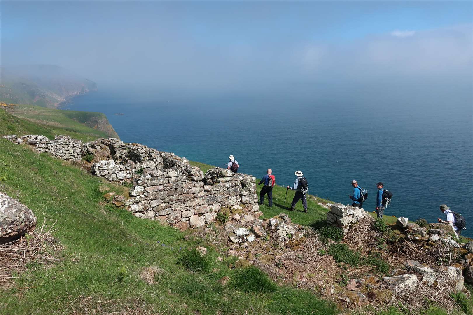 Walkers on the John O'Groat Trail pass Badbae Clearance village on the route near Berriedale. Picture: John Davidson