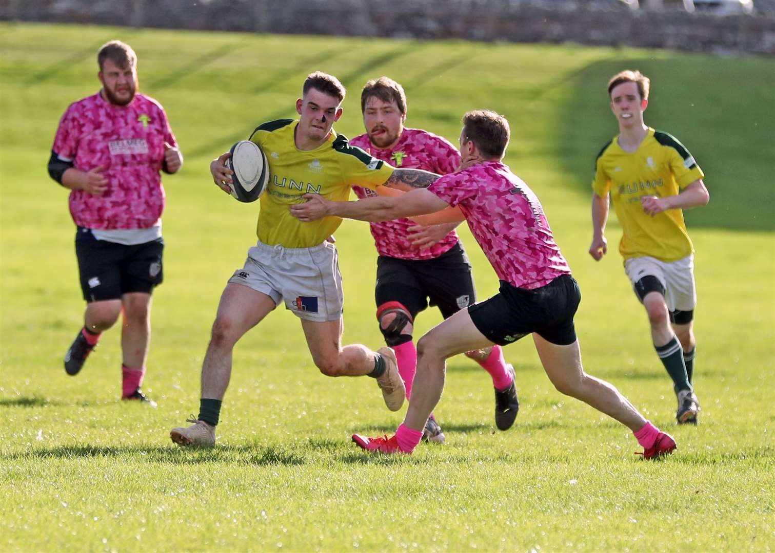 Jack Macleod of Caithness 2nd XV holds off a challenge from a Turriff opponent. Picture: James Gunn