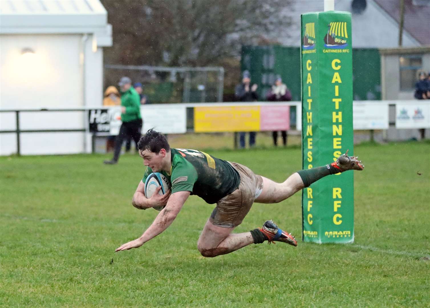 Jordan Miller flies over the try line to score for Caithness in last month's 34-7 win against Carrick at Millbank, a result that lifted the Greens out of the relegation zone. Picture: James Gunn