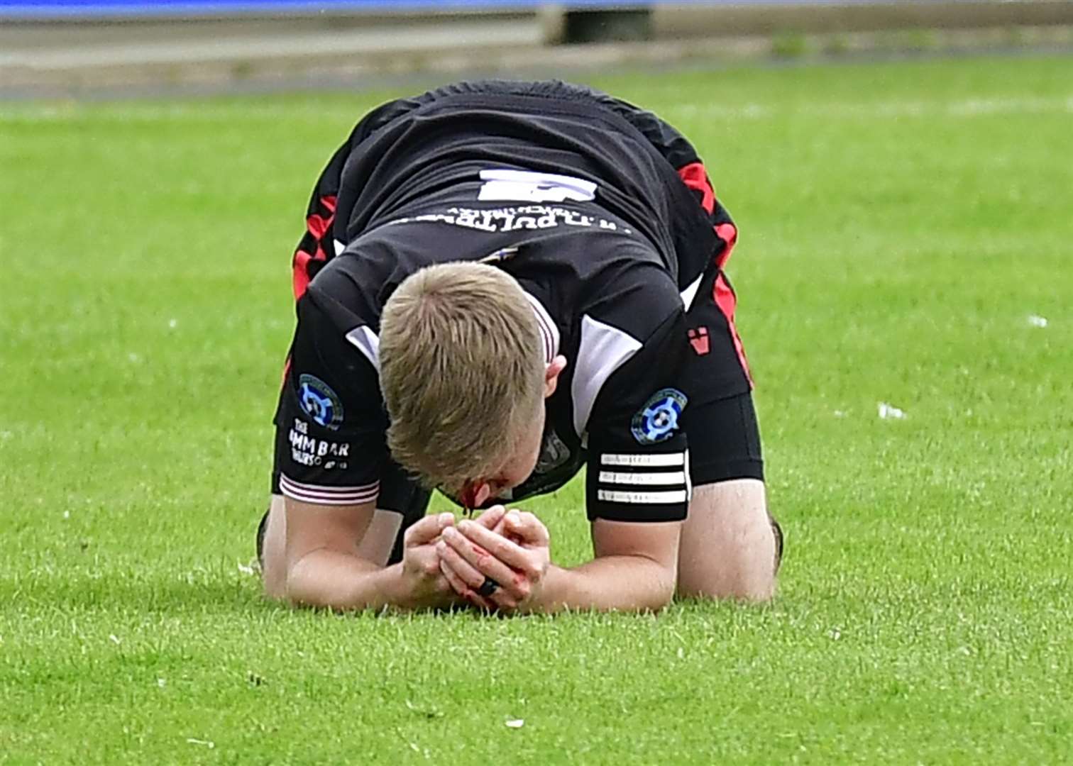 Academy captain Alan Farquhar required seven stitches after a clash of heads with Buckie's Kevin Fraser. Picture: Mel Roger