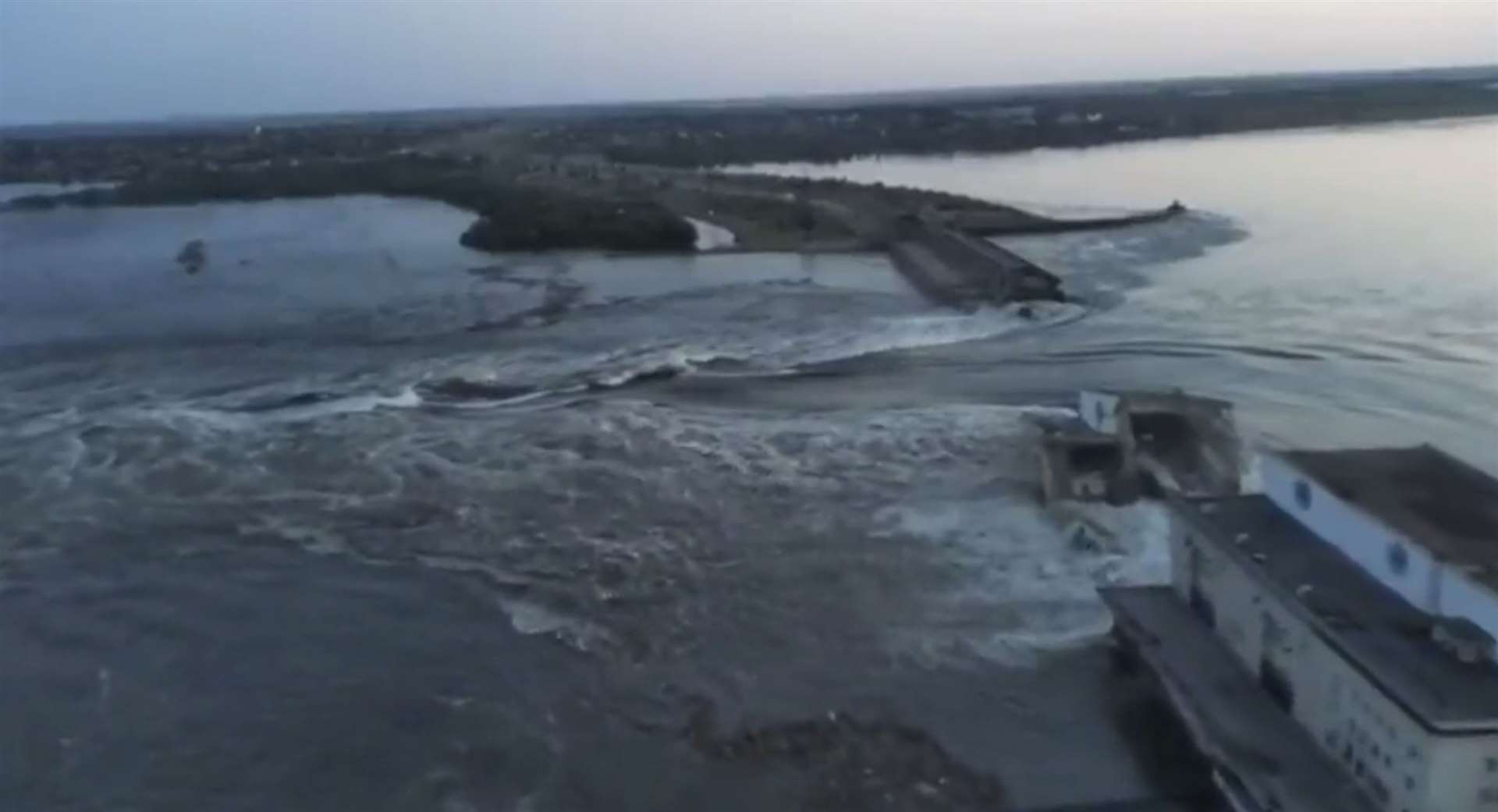 Water runs through a break in the Kakhovka dam in Kakhovka, Ukraine (Ukrainian Presidential Office via AP/PA)