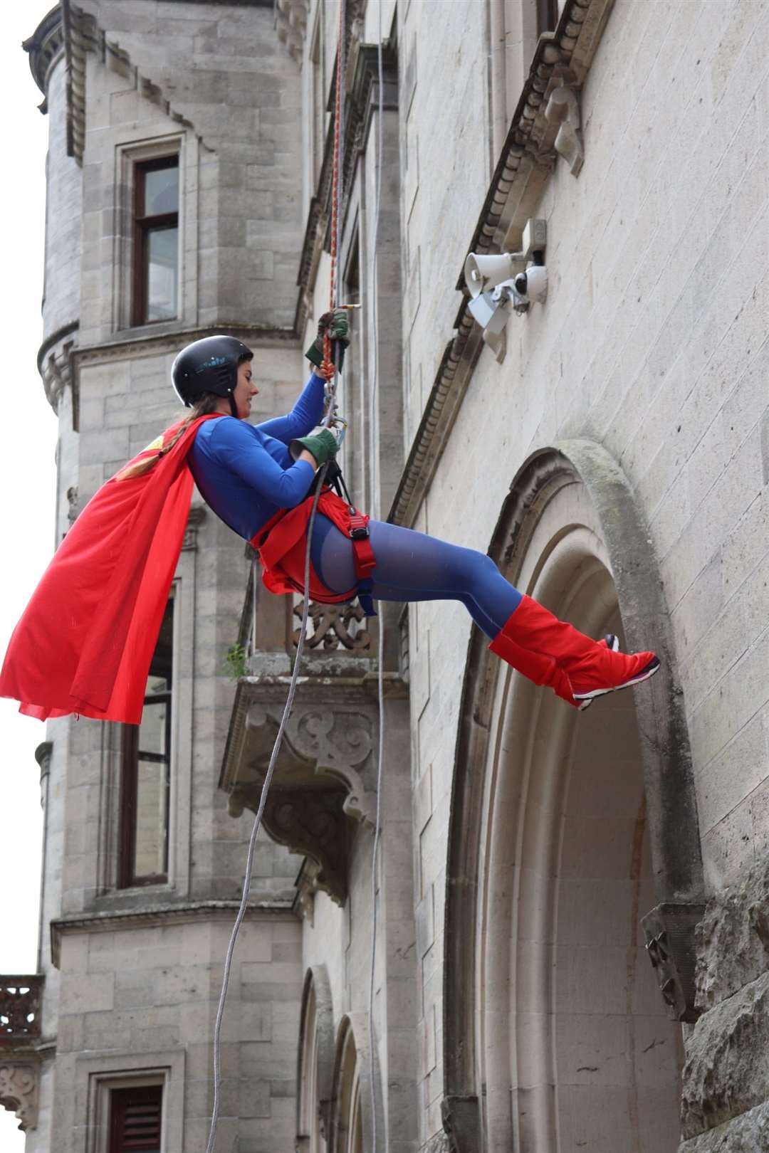 Susan Andrew makes her way down Dunrobin Castle on the fundraising abseil. Picture: April Sutherland