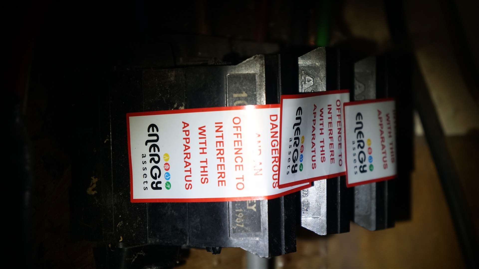 Stickers placed in the electrical supply box warning it is an offence to tamper with them. Picture: DGS