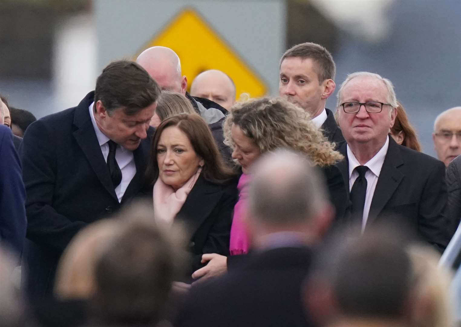 Family and mourners arrive at St Michael’s Church, in Creeslough, for the funeral mass of Robert Garwe and his five-year-old daughter Shauna Flanagan Garwe (Niall Carson/PA)