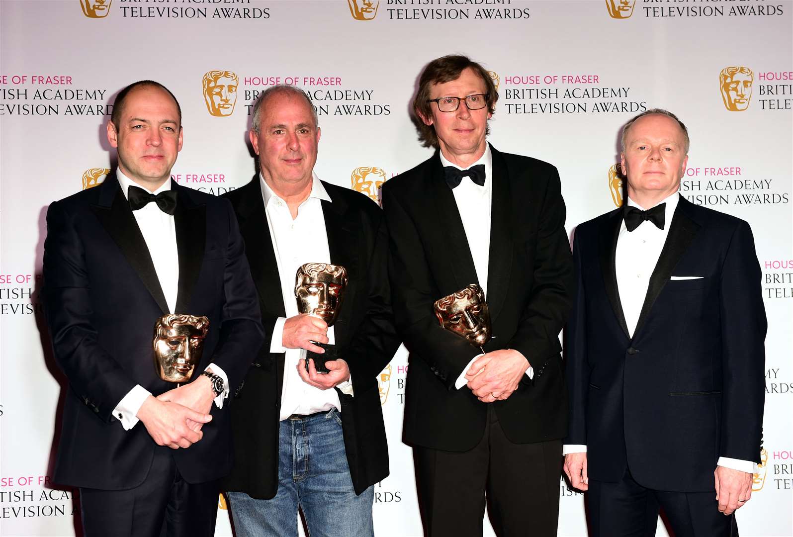 Roger Michell (seond left) with Gareth Neame, Kevin Loader and Jason Watkins with their Baftas for The Lost Honour Of Christopher Jefferies (Ian West/PA)