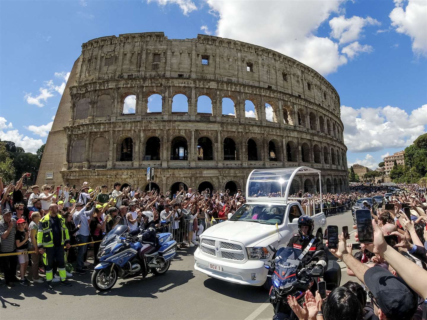 The coffin of Pope Francis is transported past the Colosseum on its way to St Mary Major (Mauro Scrobogna/LaPresse via AP)