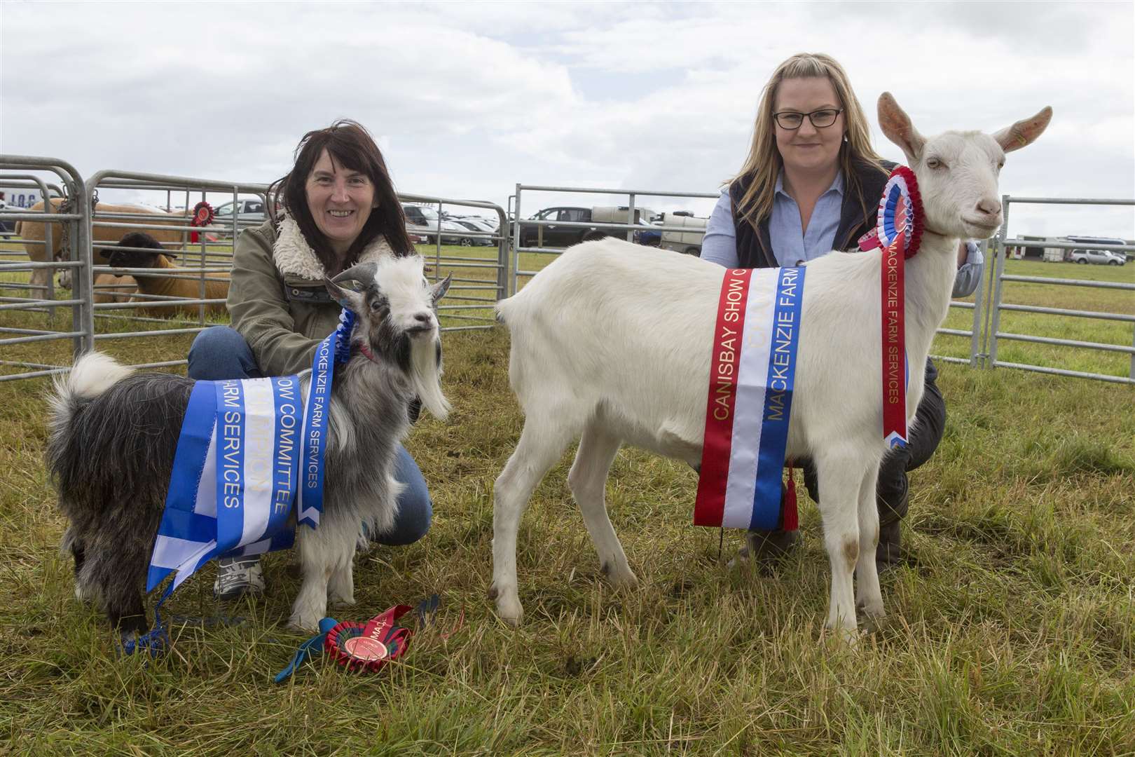 Robbianne Harrold (left), Reiss, with her champion and reserve goats. Janice Ross is holding the champion, Dorothy, a yearling British Saanen goatling, while the reserve was Moorview Snapdragon, a 15-month-old pygmy billy goat. Picture: Robert MacDonald / Northern Studios