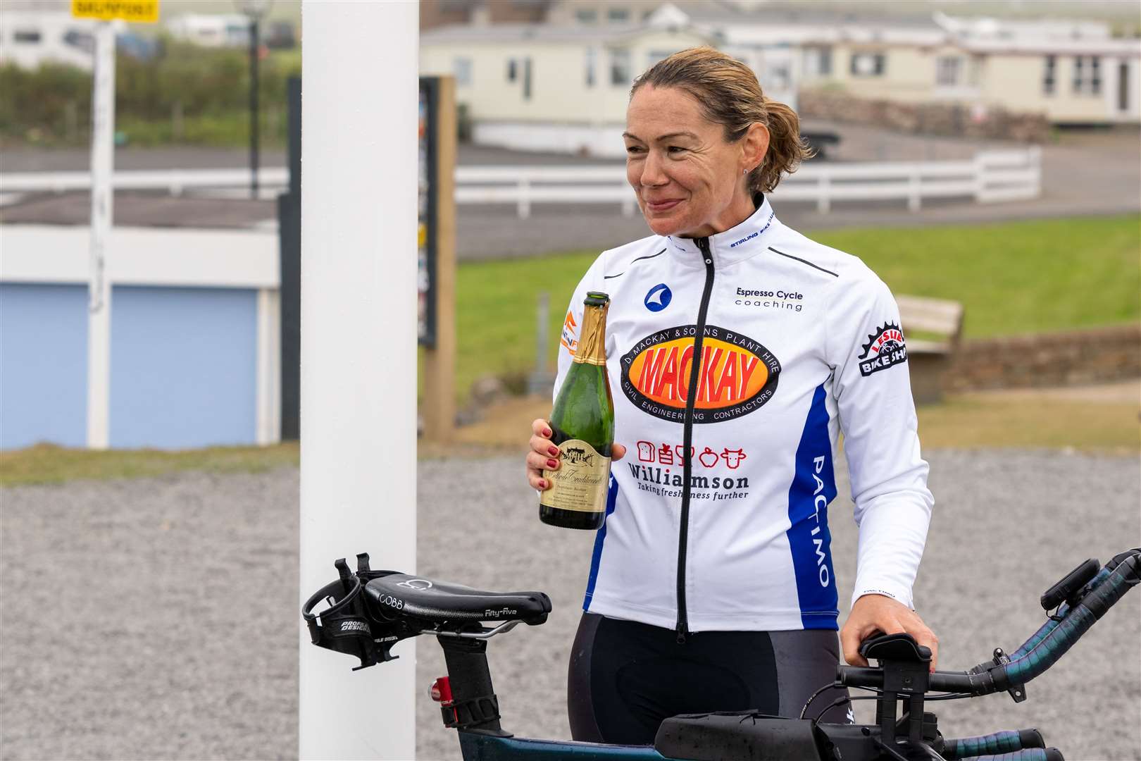 Christina Mackenzie celebrates completing her record-breaking cycle from Land's End to John O'Groats. Picture: Jasperimage