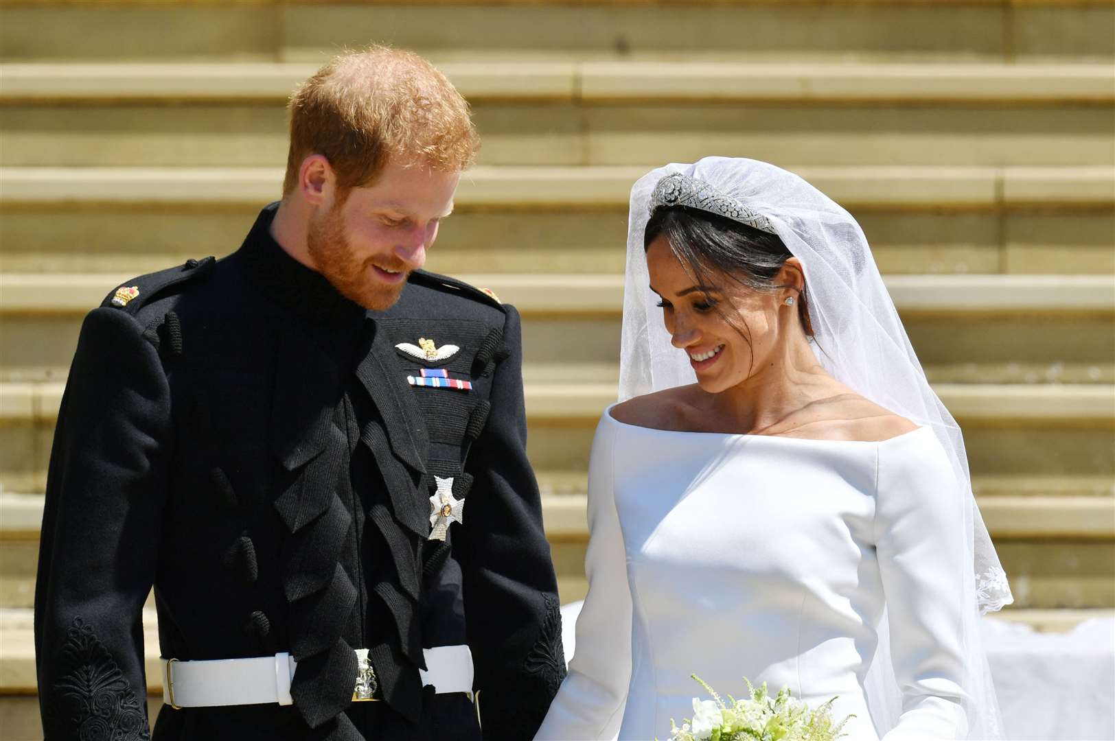 The Duke and Duchess of Sussex walking down the steps of St George’s Chapel in Windsor Castle after their wedding (Ben Birchall/PA)