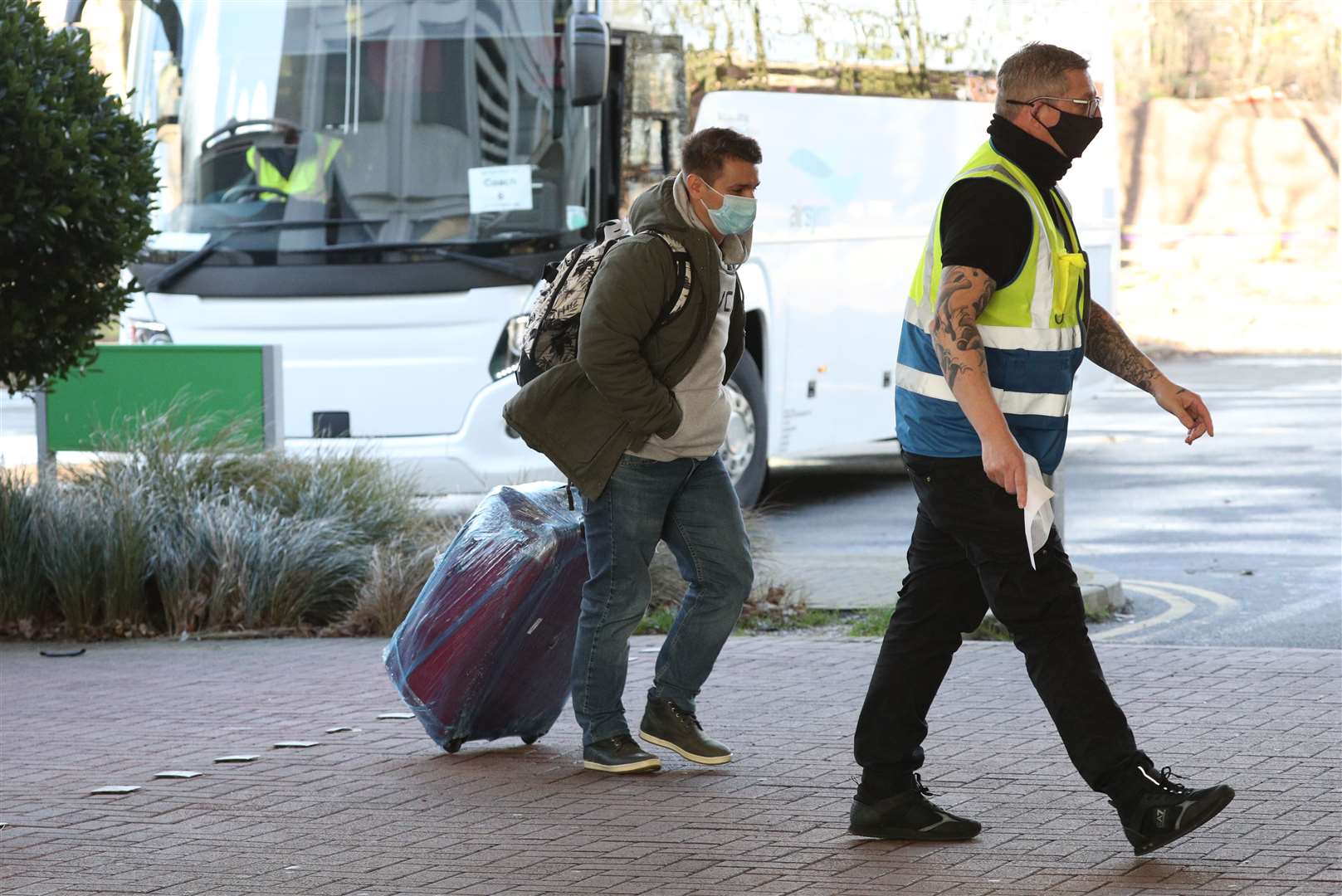 A passenger arrives at the Holiday Inn near Heathrow Airport to begin their 10-day hotel quarantine (Jonathan Brady/PA)