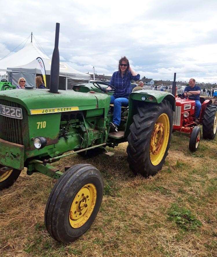 Club secretary Liz Hewitson at last month's County Show on a John Deere tractor owned by Andrew Mackay, West Greenland.