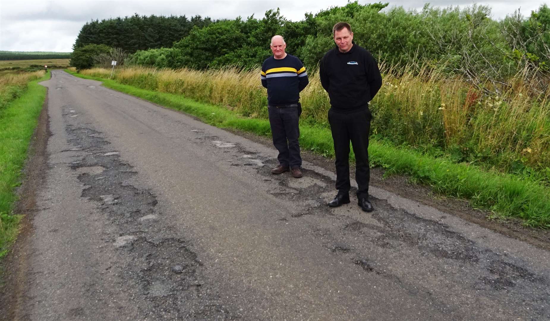 Wick-based driving instructors Adam Hendry (left) and Gary Sinclair visited some of the worst affected areas with activists from Caithness Roads Recovery.