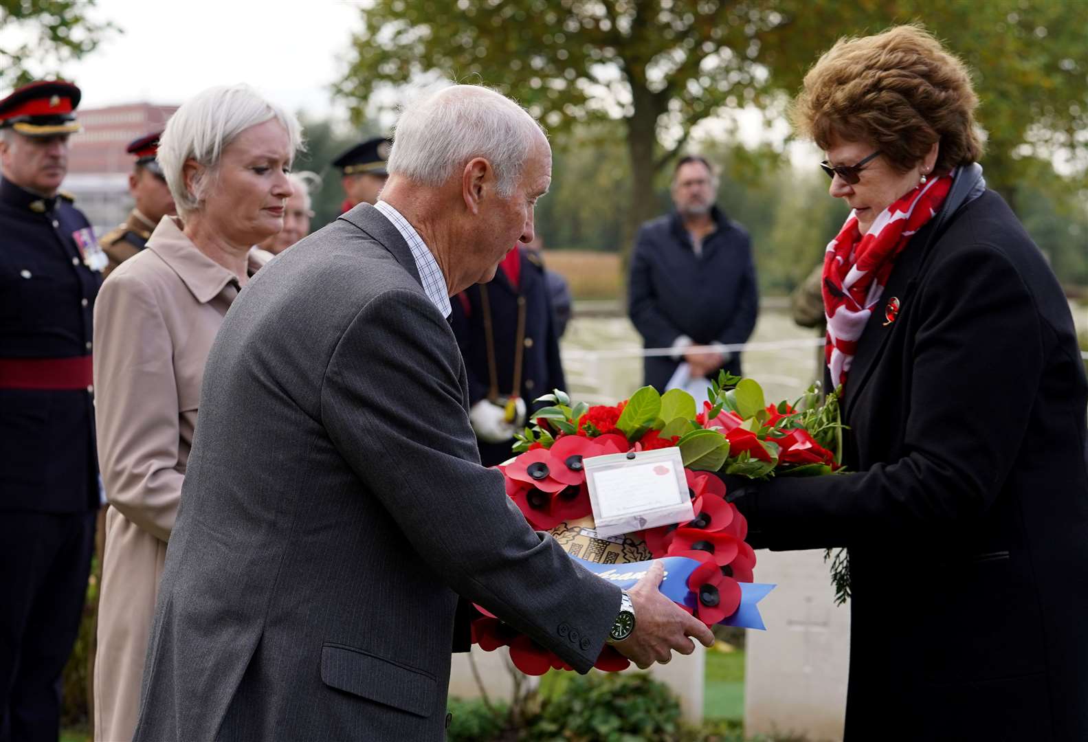 Arthur Cook and Sally Cooper, great-nephew and great-niece of Lance Corporal Robert Cook, prepare to lay a wreath (Gareth Fuller/PA)