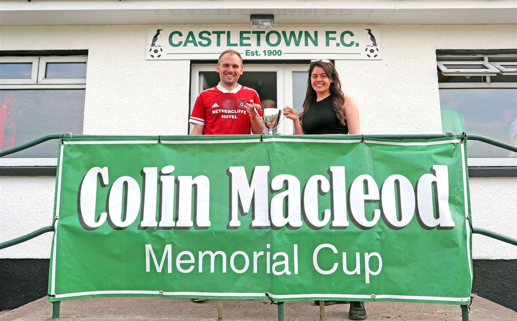 Colin Macleod's daughter Megan presents the Colin Macleod Memorial Cup to Wick Groats captain Gavin Sinclair. Picture: James Gunn