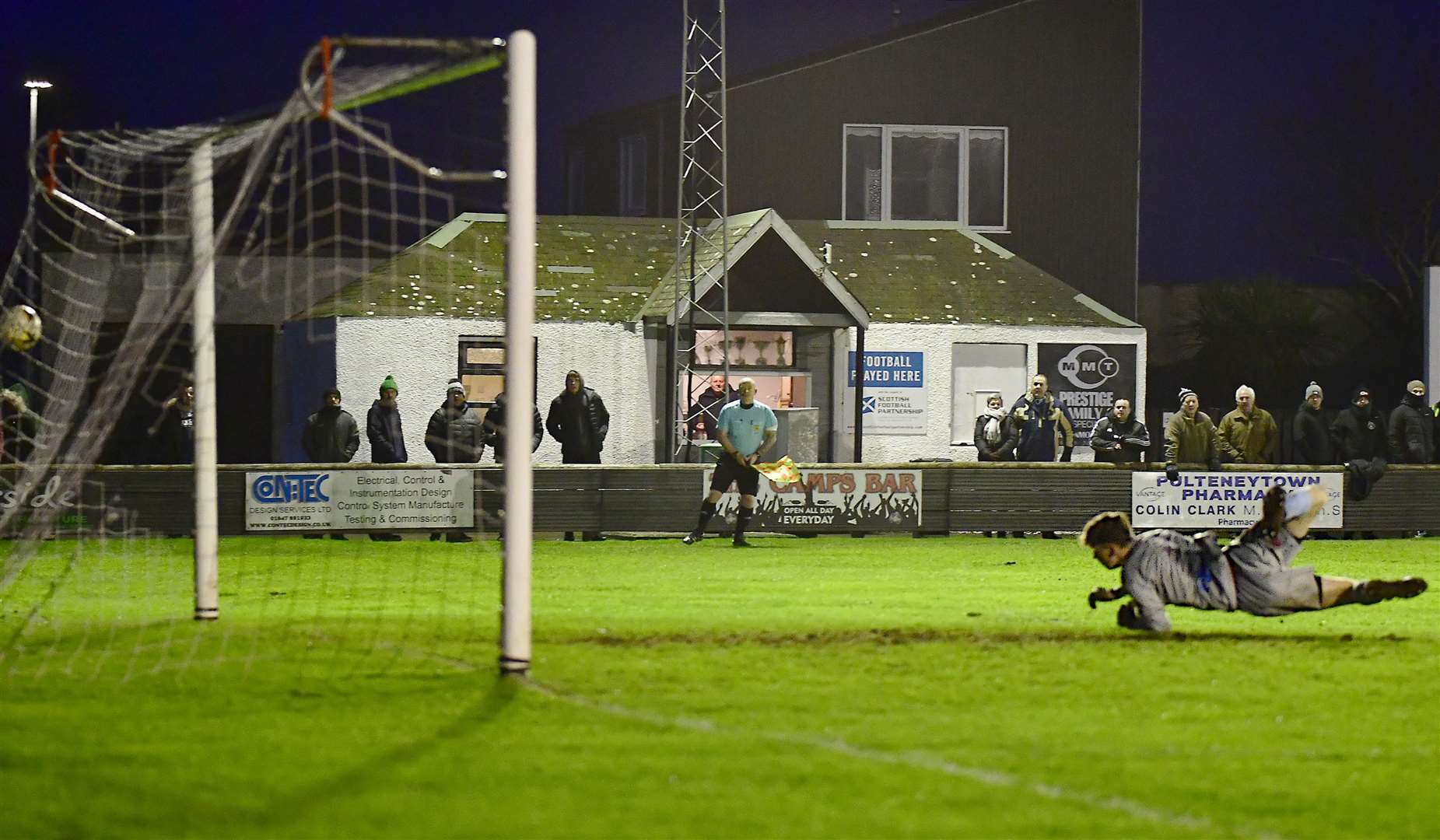 Keith keeper Jamie Shingler can do nothing to stop Davie Allan's shot flying into the net to give Wick Academy a 3-2 win at Harmsworth Park. Picture: Mel Roger