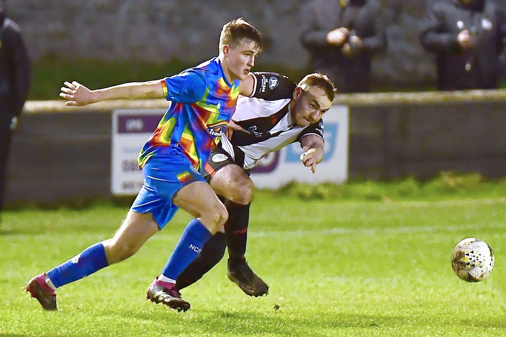 Wick Academy's Owen Harrold and Nairn County's Aaron Nicolson. Picture: Mel Roger