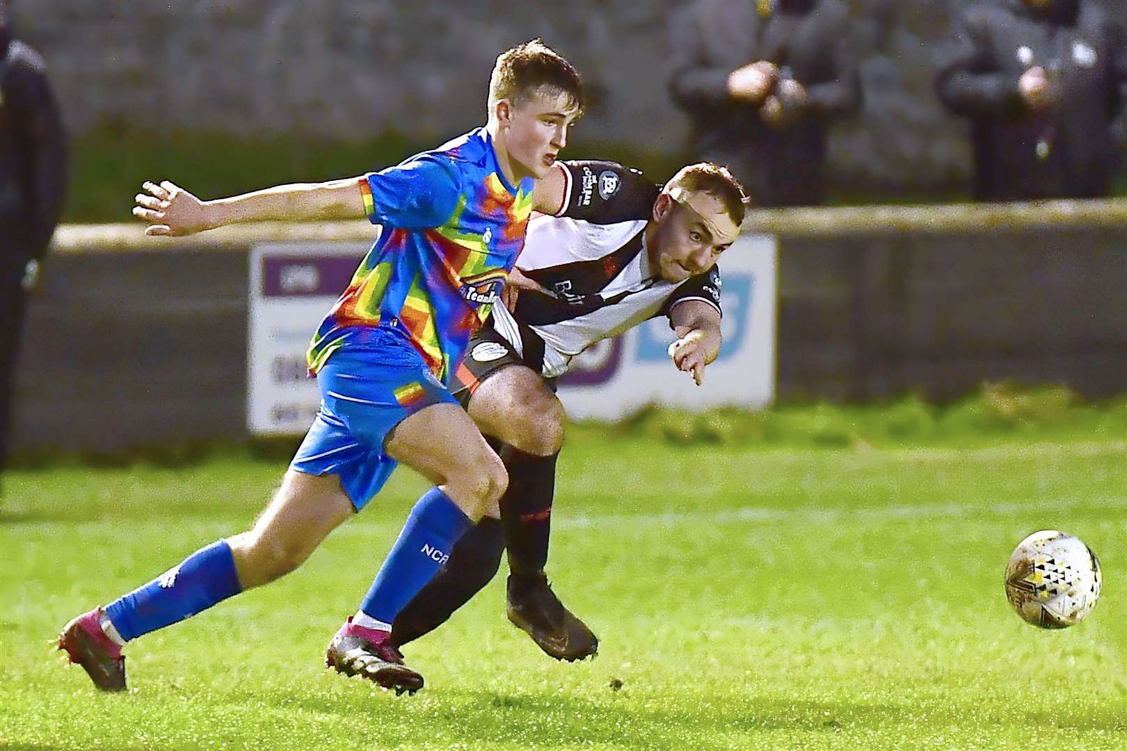 Wick Academy's Owen Harrold and Nairn County's Aaron Nicolson. Picture: Mel Roger