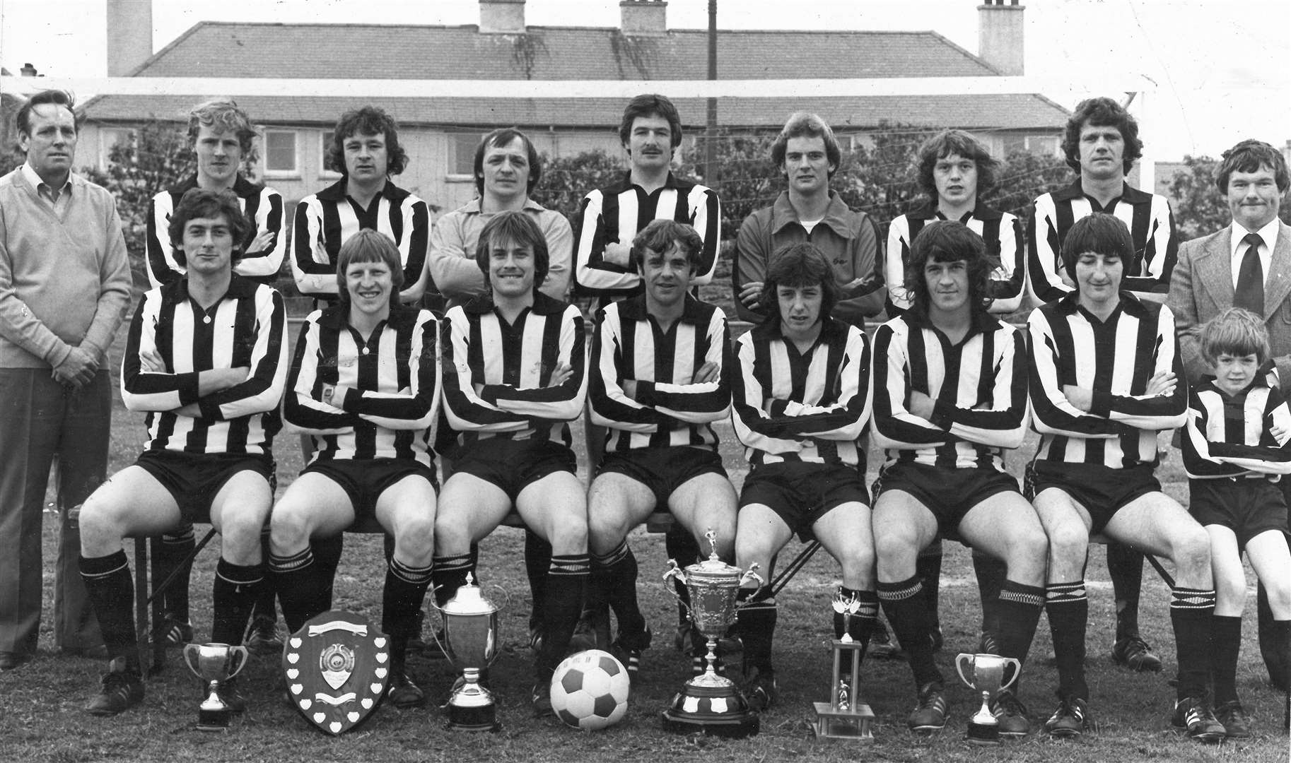 The successful Academy team of the late 1970s with their silverware. They played in the North Reserve League at that time. Picture: J McDonald Photographers