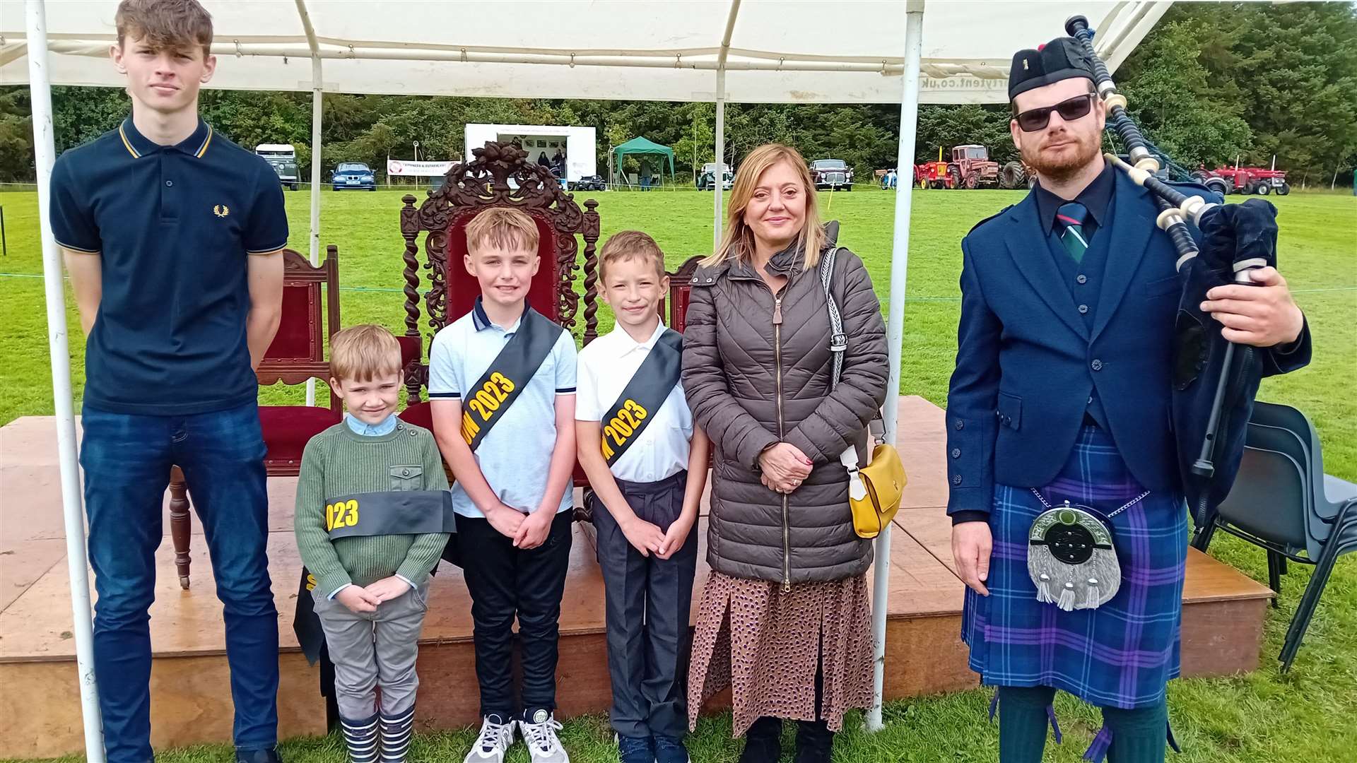 The 2023 Bower Show platform party (from left) 2019 king Kyran Alexander, attendant Austen Foubister, 2023 king Alan Pottinger, attendant Klavs Kreslins, guest speaker Sylvia Sinclair, acting head teacher at Bower Primary School, and Piper Lewis Deering. Picture: Willie Mackay