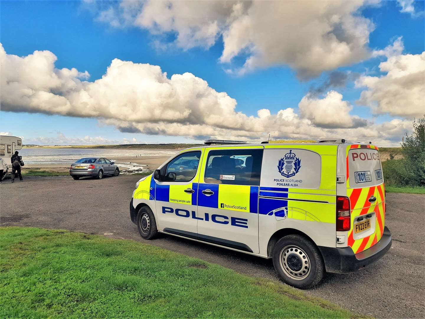Police collect the suspected human bone at Dunnet beach.