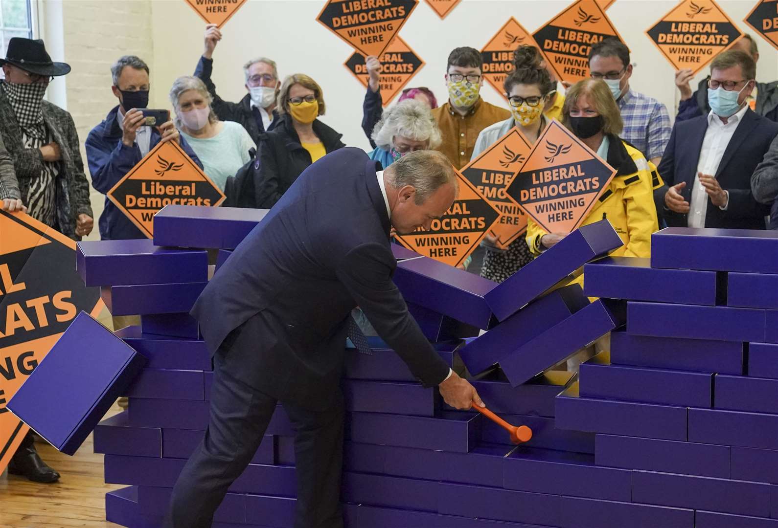 Sir Ed Davey celebrates the Lib Dems’ victory in the Chesham & Amersham by-election with a stunt at Chesham Youth Centre, Buckinghamshire (Steve Parsons/PA)
