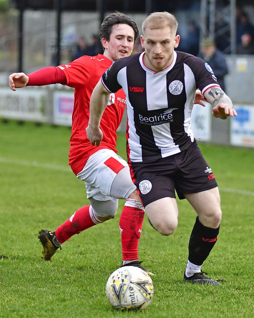 Wick Academy's Alan Hughes outpaces Nairn winger Andrew Greig. Picture: Mel Roger
