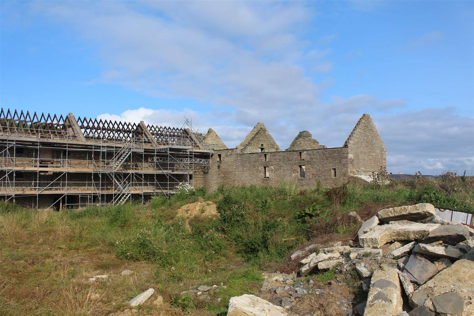 Castletown mill, with the missing roof on the 1818 building and the scaffolding surround the 1888 extension. Picture: John Davidson